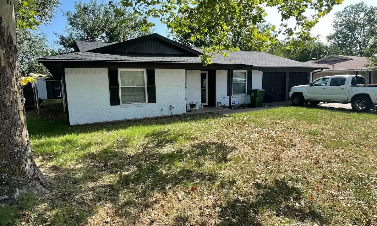 Professional roofing crew working on a residential roof in Edwardsville